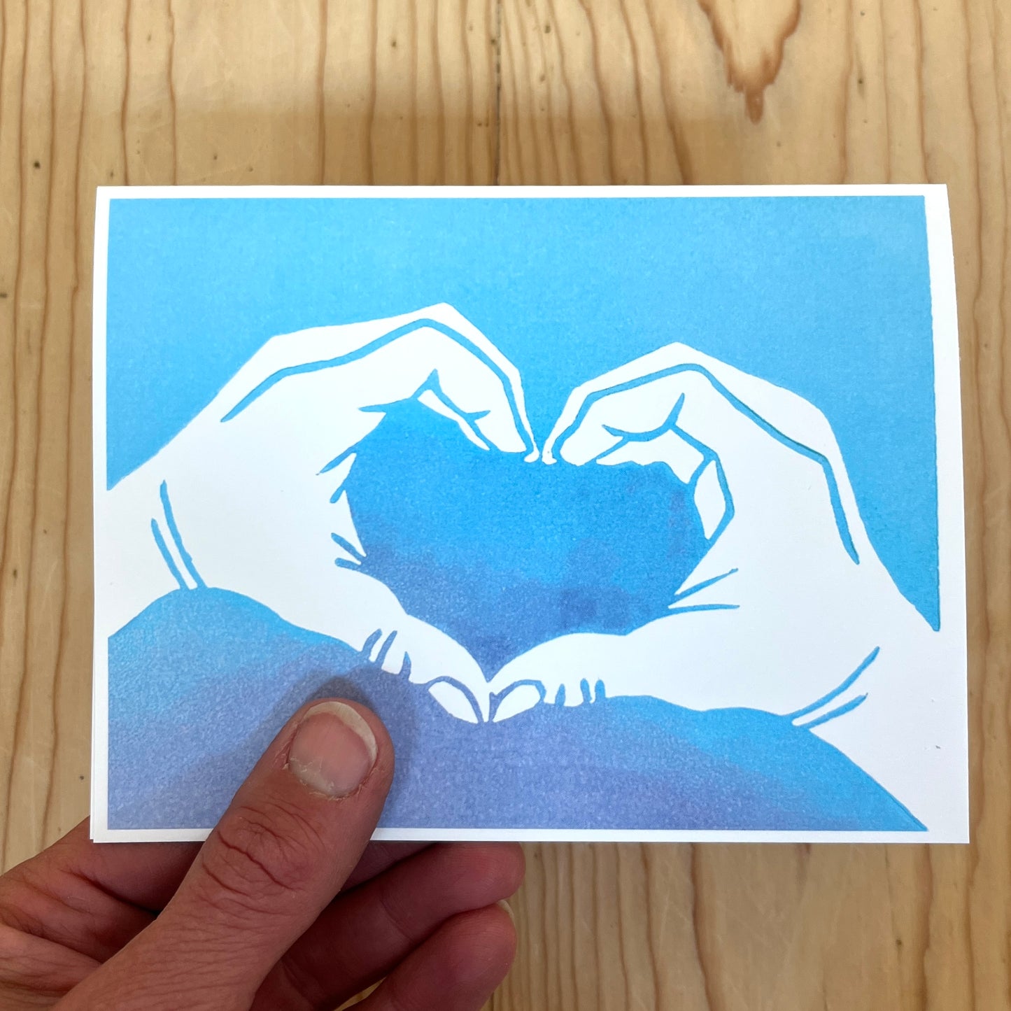Heart hands in blue